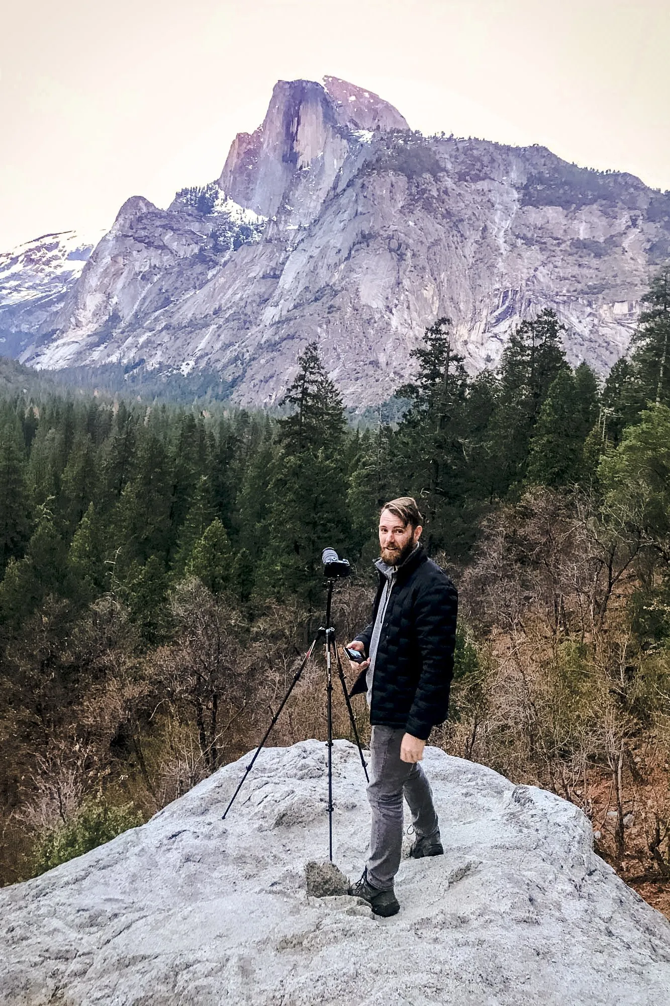 Brent standing beside a camera in Yosemite Valley